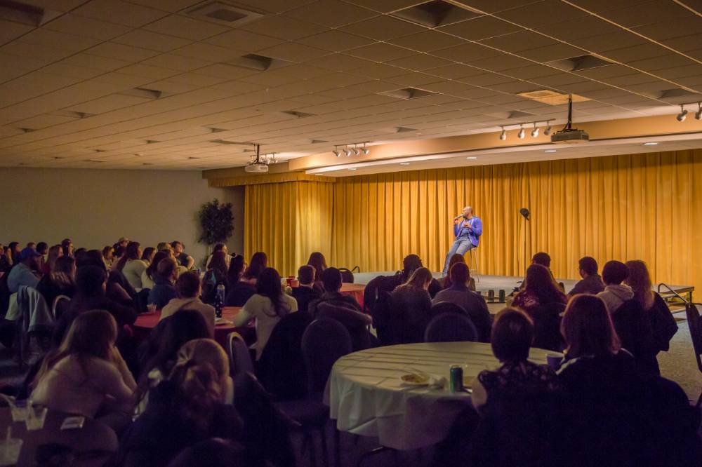 A comedy show in the Grand River Room.